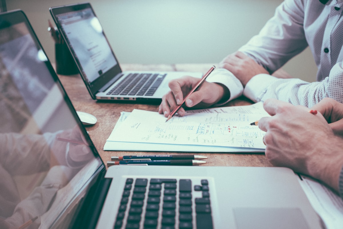 Consultant reviewing financial documents at a desk